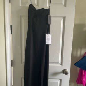 Black fitted prom dress with triangle cut out in the middle - such a cute dress